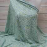 Au mètre jersey viscose fond blanc, graffitis anis et turquoise en 145cm n°10398