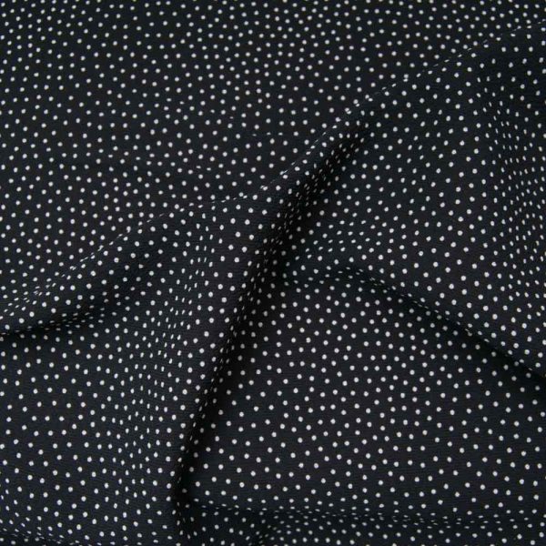 Crêpe polyester de qualité noir à mini pois blancs