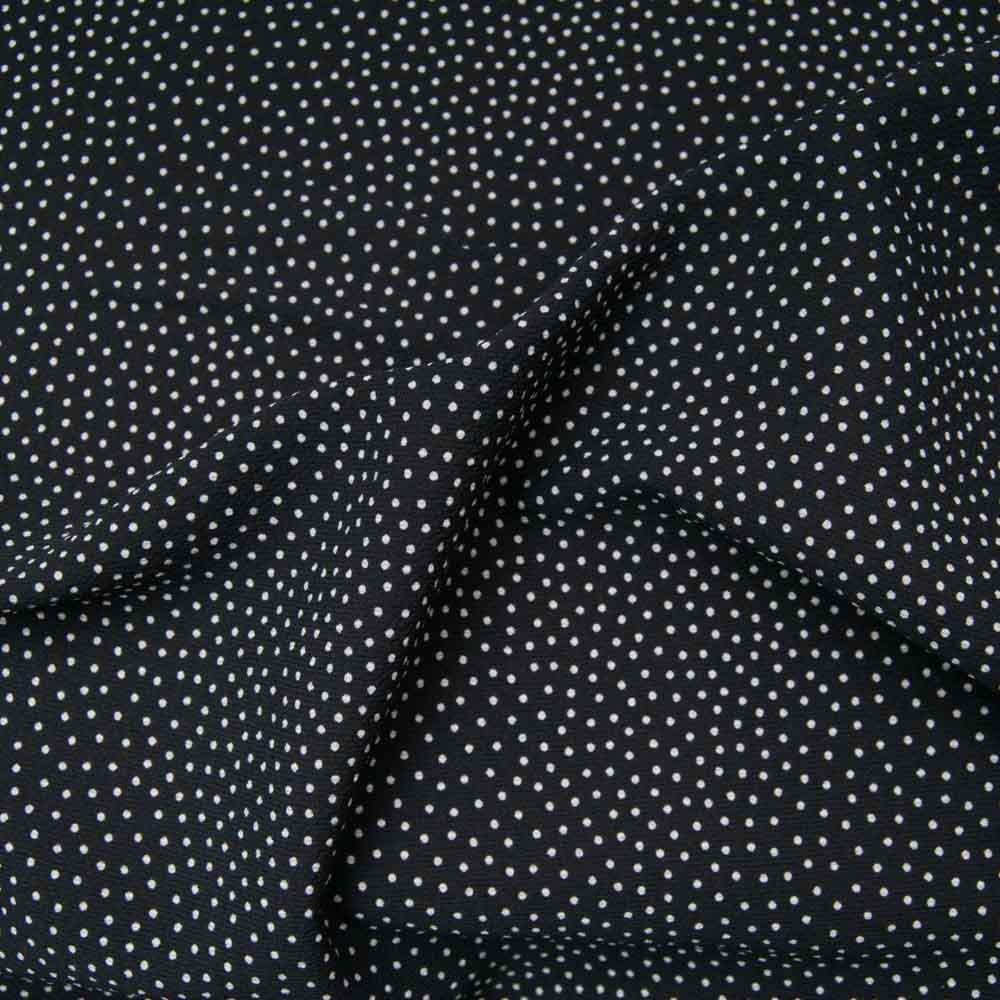 Crêpe polyester de qualité noir à mini pois blancs