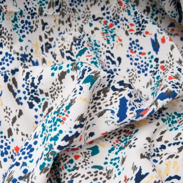 Crêpe viscose fond beige, petit graffitis multicolore