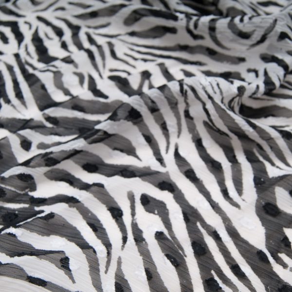 Coupon voile crépon polyester fond blanc zébré noir 1m60