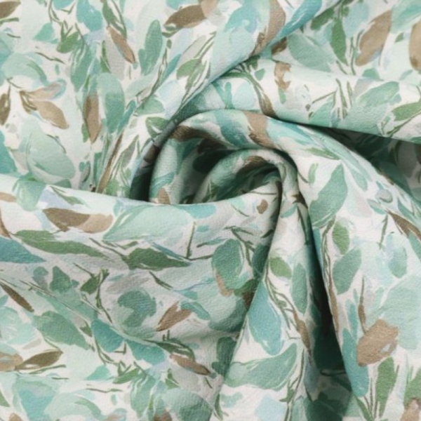 Crêpe Viscose motif petites feuilles fond vert amande