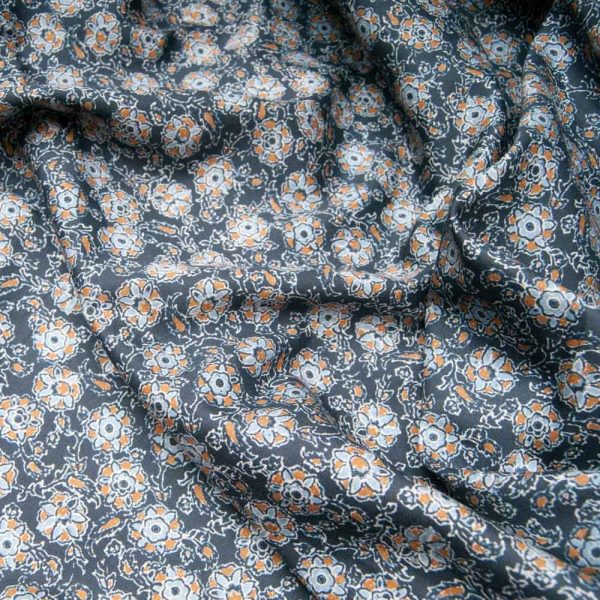 Tissu Coton fond bleu marine fleur ocre et ciel
